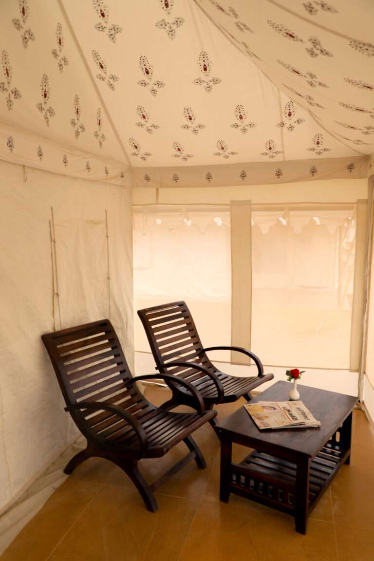 Jaisalmer suite tent outside where we places beautiful luxury chair where you can enjoy the view of desert located in sam sand dunes